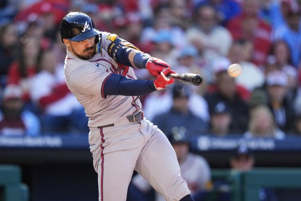   Braves rally for seven in the eighth to begin defense of NL East crown with 9-3 win over Phillies